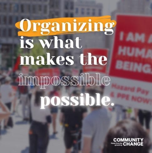 image from a rally that says "organizing is what makes the impossible possible" with the Community Change logo